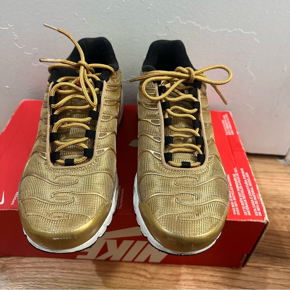 Nike Women's Metallic Gold and Black Sneaker